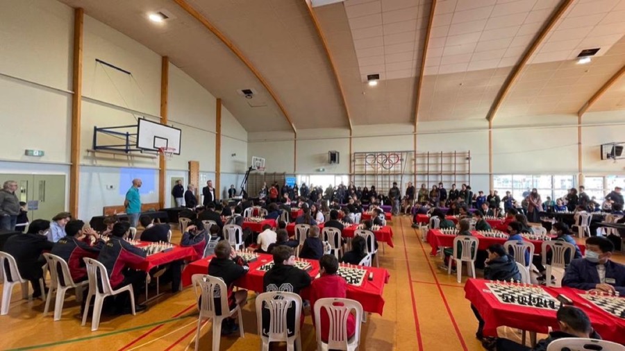 Students at a chess tournament hall